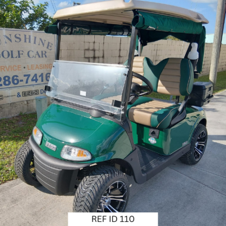 2022 Forest Green E-Z-GO RXV Elite golf cart with custom seats and 14-inch wheels