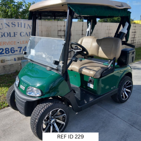 2022 Forest Green E-Z-GO RXV Elite golf cart with premium seats and custom enclosure