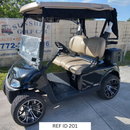 Black E-Z-GO RXV Elite golf cart with custom enclosure, 14-inch wheels, and Samsung lithium battery