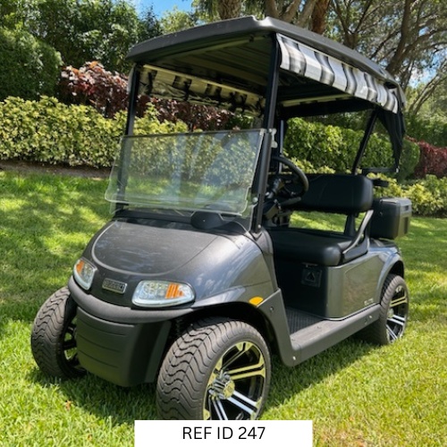 2021 charcoal E-Z-GO RXV Elite golf cart with 14-inch wheels, premium seats, and Sunbrella enclosure