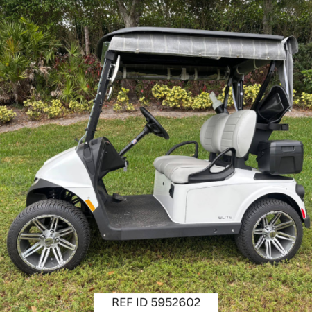 2026 E-Z-GO RXV Freedom Elite Bright White with enclosure, premium seats, and custom wheels